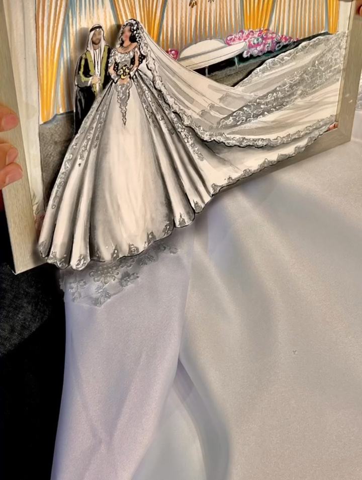 Framed wedding painting with the bride's dress coming out of the frame
