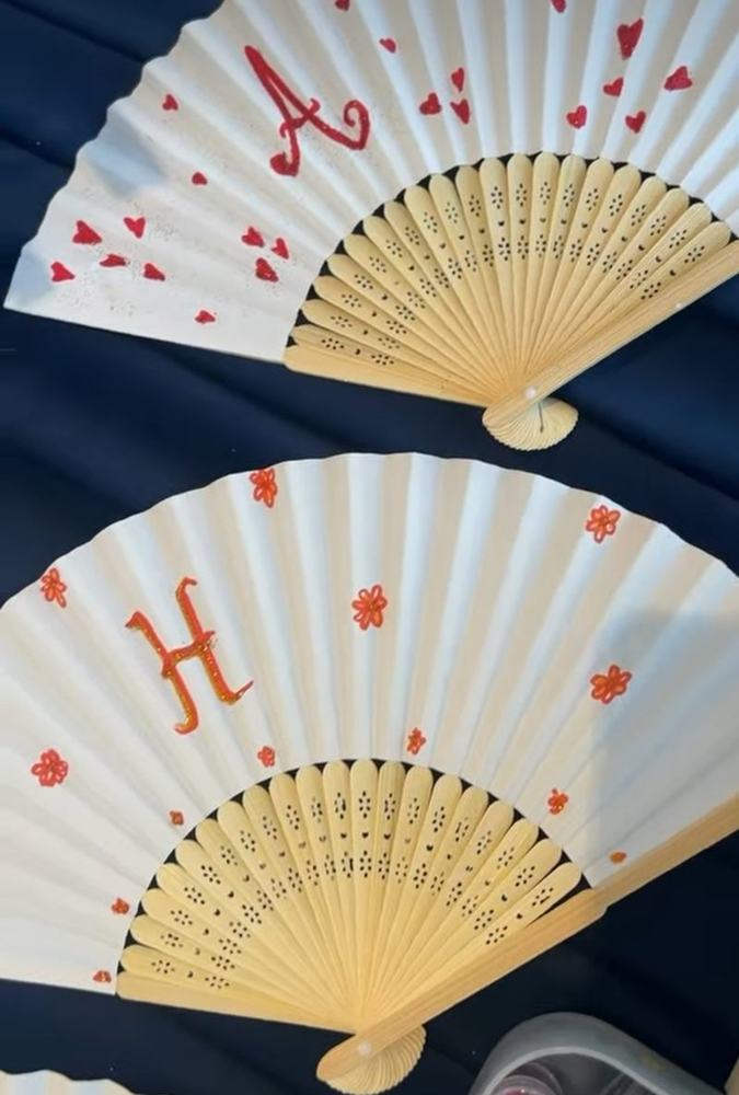 Fans painted with initials, hearts and flowers